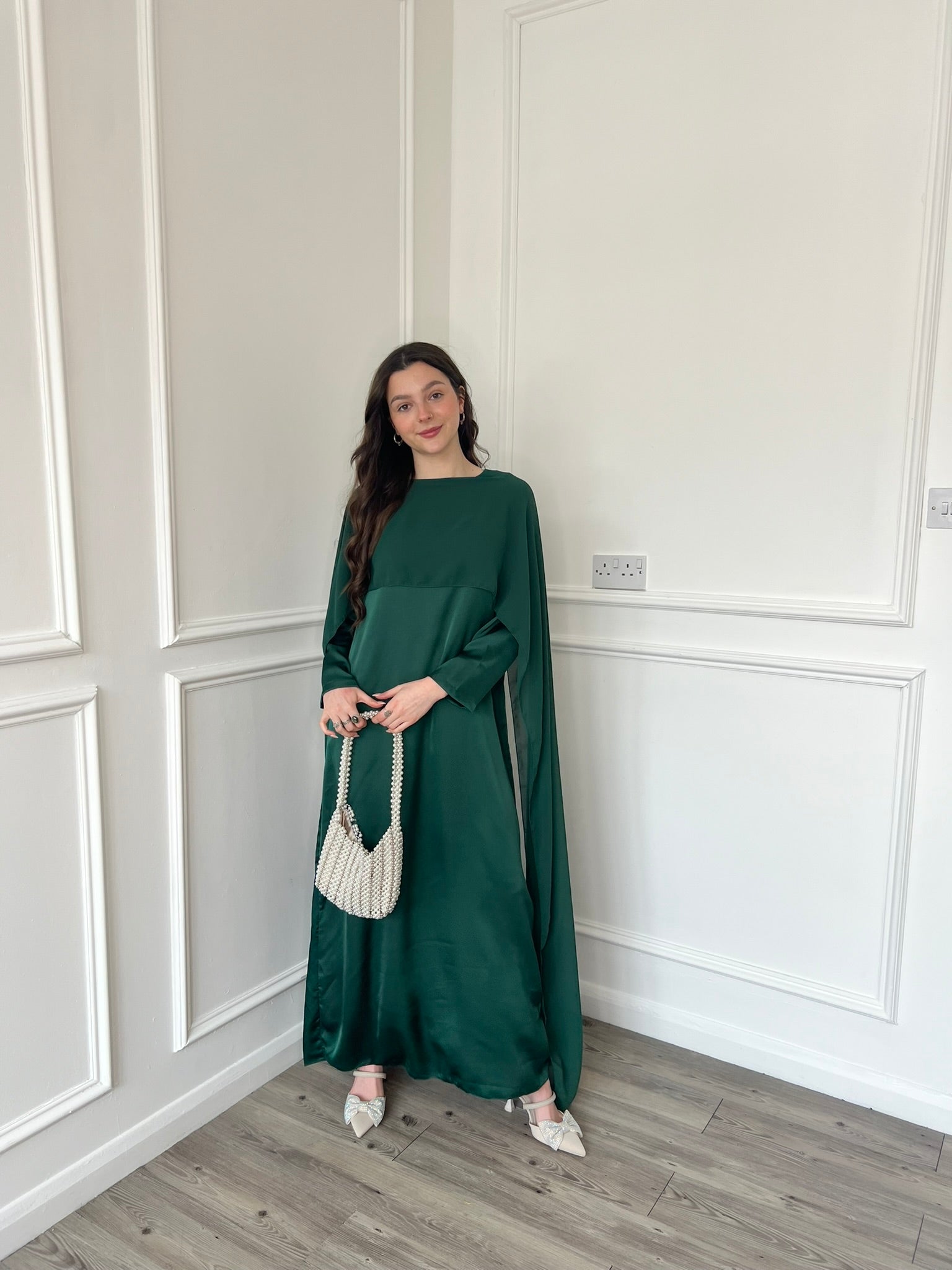 Emerald green cape dress hotsell